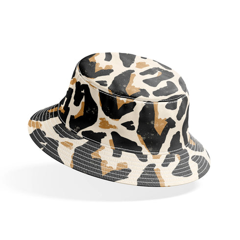 Estampado abstracto negro y dorado con formas orgánicas irregulares sobre fondo crema bucket hat mockup