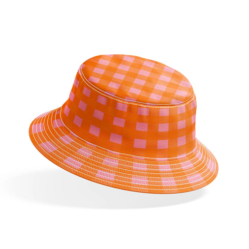 Patrón de cuadros en tonos naranja, rosado y coral vibrantes formando diseño de cuadrícula uniforme