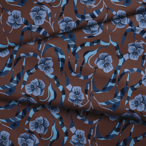 Patrón floral de pensamientos azules sobre fondo marrón con cintas azul y blanco entrecruzadas fabric fold mockup