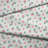 Patrón floral con rosas rosadas sobre fondo de rayas verticales grises y blancas fabric fold mockup