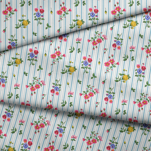 Patrón floral con rosado, amarillo y azul sobre rayas verticales azules y blancas fabric fold mockup