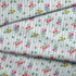 Patrón floral con rosado, amarillo y azul sobre rayas verticales azules y blancas fabric fold mockup