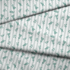 Patrón decorativo con rayas verticales y motivos florales de ramas verdes sobre fondo blanco fabric fold mockup