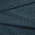 Estampado animal print de leopardo en negro sobre fondo azul petróleo fabric fold mockup