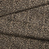 Estampado animal print de leopardo en café y beige sobre fondo negro fabric fold mockup