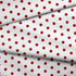 Patrón de pepas rojas sobre fondo blanco