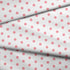 Patrón de pepas rosadas sobre fondo blanco