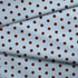 Lunares café sobre fondo celeste con distribución uniforme