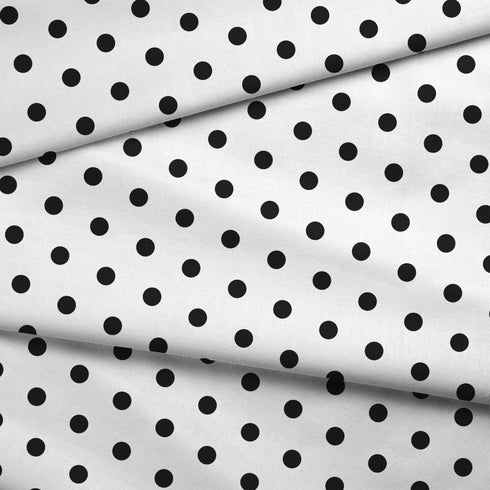Patrón de pepas negras sobre fondo blanco, distribución uniforme y aleatoria
