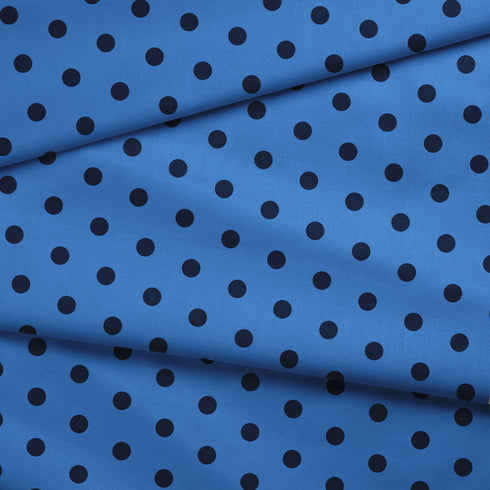 Patrón de pepas negras sobre fondo azul distribuidas uniformemente