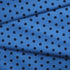 Patrón de pepas negras sobre fondo azul distribuidas uniformemente
