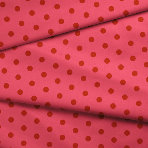 Fondo rosado con pepas café distribuidas uniformemente