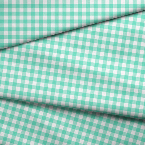 Patrón de cuadros turquesa y verde menta sobre fondo blanco en diseño geométrico regular