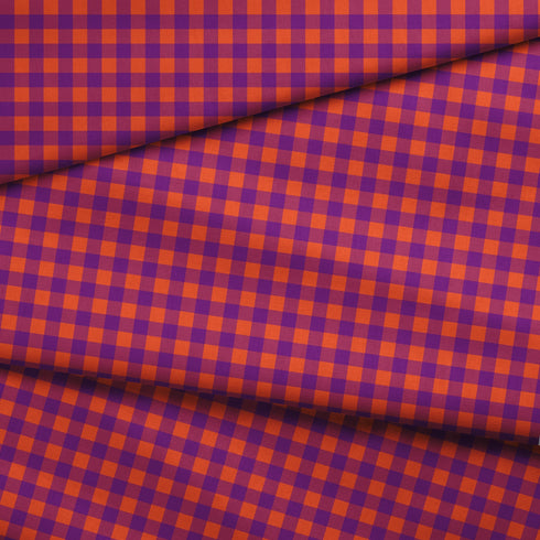 Patrón de cuadros en tonos morado, naranja y vino tinto con diseño geométrico repetitivo