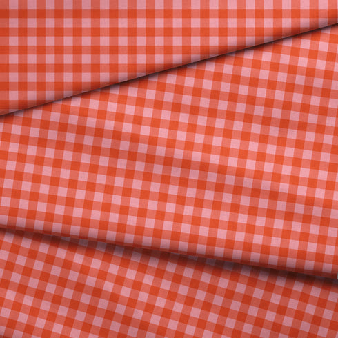 Patrón de cuadros en tonos rosados, rojos, naranjas y coral con efecto degradado
