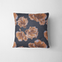 Flores estilizadas en tonos ocre y marrón sobre fondo negro oscuro, diseño artístico botánico decorativo fabric pillow mockup