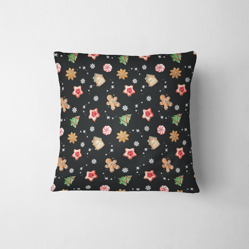 Patrón navideño con galletas decoradas en forma de estrellas, copos de nieve, árbol, casa y muñeco de jengibre sobre fondo negro. fabric pillow mockup