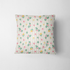 Patrón floral con rosas rosadas y amarillas sobre fondo de rayas beige y crema con hojas verdes fabric pillow mockup