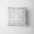Patrón floral con rosas rosadas sobre fondo de rayas verticales grises y blancas fabric pillow mockup