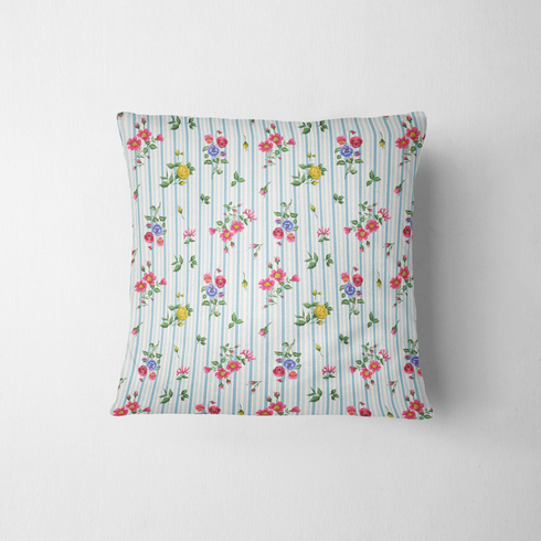 Patrón floral con rosado, amarillo y azul sobre rayas verticales azules y blancas fabric pillow mockup