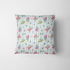 Patrón floral con rosado, amarillo y azul sobre rayas verticales azules y blancas fabric pillow mockup