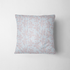 Patrón de rayas verticales azul cielo con delicadas flores rosado pálido dispersas fabric pillow mockup