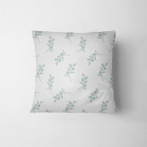 Patrón floral azul con ramas delicadas sobre fondo de rayas blancas y grises, estilo botánico fabric pillow mockup