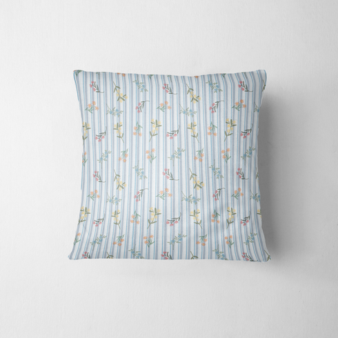 Patrón floral con líneas verticales en tonos azules, flores rosadas y amarillas sobre fondo rayado fabric pillow mockup