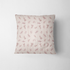 Patrón de rayas verticales en tonos rosado pálido y crema con delicados motivos florales de ramas y hojas fabric pillow mockup