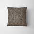 Estampado animal print de leopardo en café y beige sobre fondo negro fabric pillow mockup
