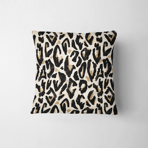 Estampado abstracto negro y dorado con formas orgánicas irregulares sobre fondo crema fabric pillow mockup