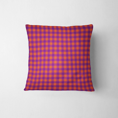 Patrón de cuadros en tonos morado, naranja y vino tinto con diseño geométrico repetitivo