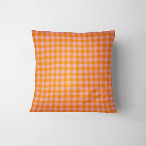 Patrón de cuadros en tonos naranja, rosado y coral vibrantes formando diseño de cuadrícula uniforme