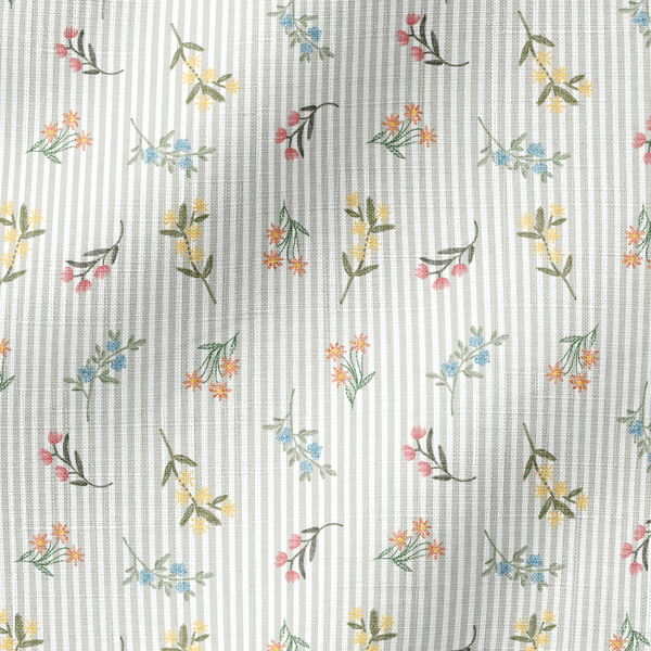Patrón delicado de flores pequeñas en tonos rosado, amarillo y azul sobre fondo gris con rayas blancas fabric ripple mockup