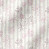 Patrón floral con flores rosado pálido sobre fondo de rayas verticales en tonos crema y beige fabric ripple mockup