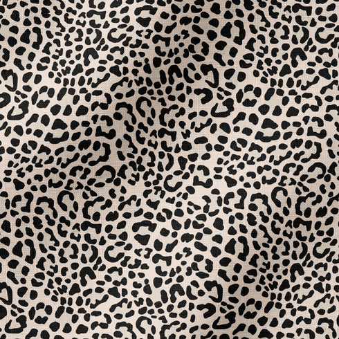 Estampado de pepas negras estilo leopardo sobre fondo beige fabric ripple mockup