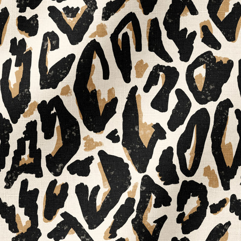 Estampado abstracto negro y dorado con formas orgánicas irregulares sobre fondo crema fabric ripple mockup