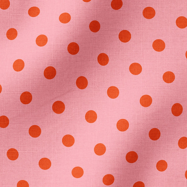 Patrón de pepas naranja sobre fondo rosado