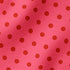 Fondo rosado con pepas café distribuidas uniformemente
