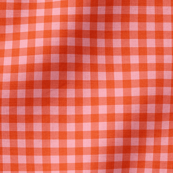 Patrón de cuadros en tonos rosados, rojos, naranjas y coral con efecto degradado