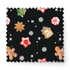 Patrón navideño con galletas decoradas en forma de estrellas, copos de nieve, árbol, casa y muñeco de jengibre sobre fondo negro. fabric swatch mockup