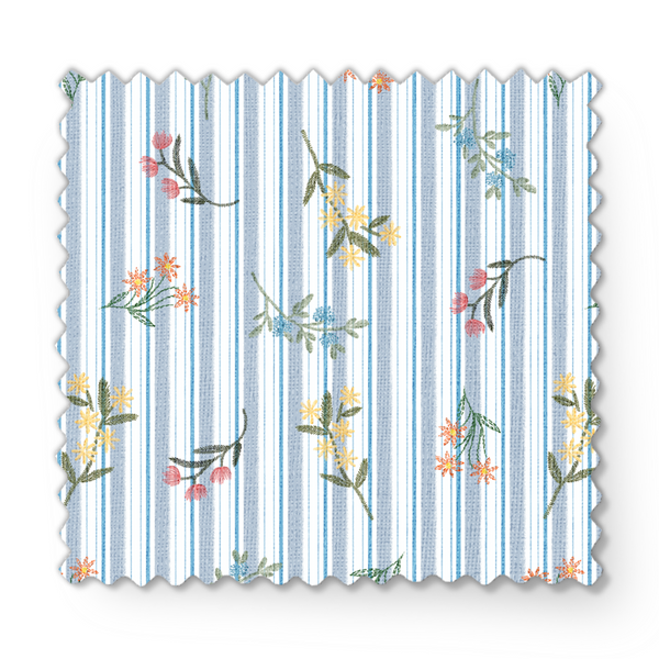 Patrón floral con líneas verticales en tonos azules, flores rosadas y amarillas sobre fondo rayado fabric swatch mockup