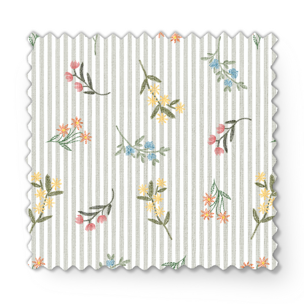Patrón delicado de flores pequeñas en tonos rosado, amarillo y azul sobre fondo gris con rayas blancas fabric swatch mockup
