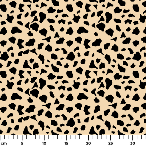 Patrón de pepas irregulares negras sobre fondo beige estilo animal print ruler cm