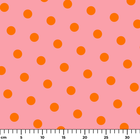 Patrón de pepas naranjas sobre fondo rosado