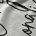 Firma cursiva en tinta negra sobre fondo gris claro. sutex blanket detail rotated