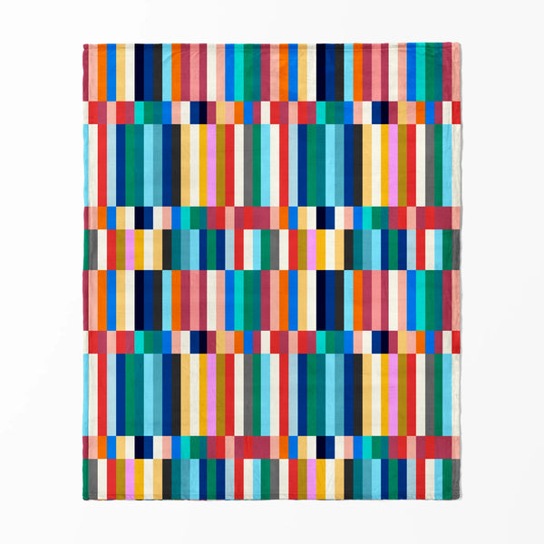 Franjas verticales multicolor vibrantes en bloques geométricos con tonos naranja, azul, verde, rosado, amarillo y café