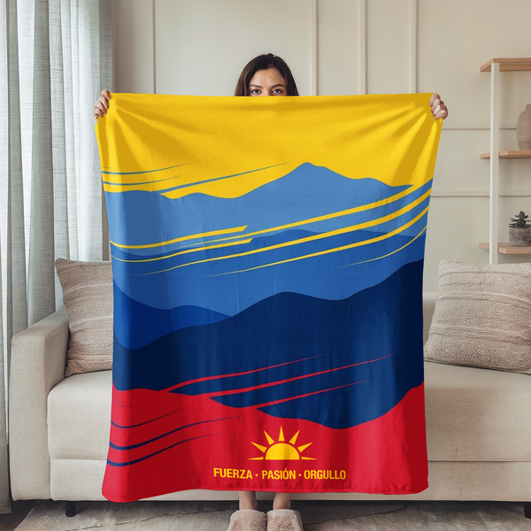 Montañas estilizadas en capas de azul y rojo con sol dorado, diseño gráfico inspirado en bandera colombiana sutex blanket person new