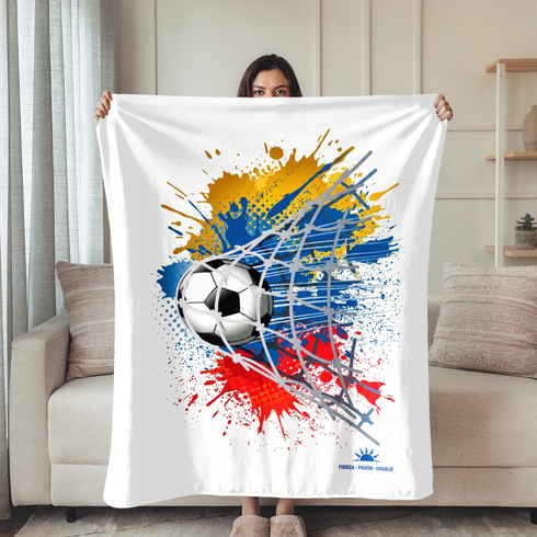 Balón de fútbol atravesando red con salpicaduras vibrantes en amarillo, azul y rojo sobre fondo blanco sutex blanket person new