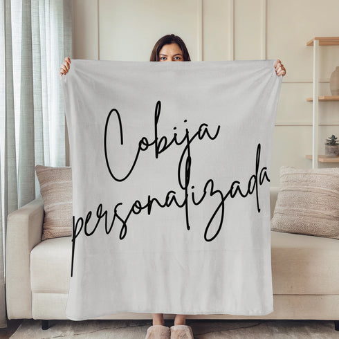 Firma cursiva en tinta negra sobre fondo gris claro. sutex blanket person rotated